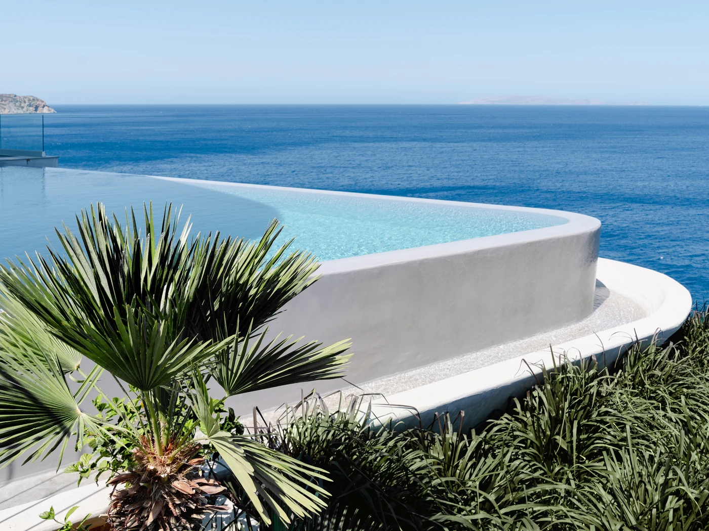Meltemi Villa heated infinity pool merging with Aegean Sea — Crete luxury villa rental