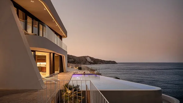 Meltemi Villa evening exterior with infinity pool and Aegean view