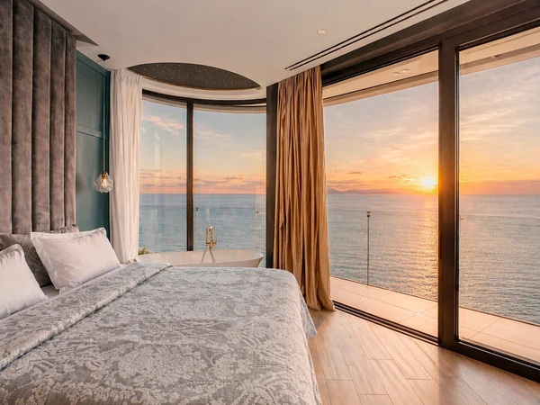 Luxury master suite with sunset Aegean view — Meltemi Villa Crete